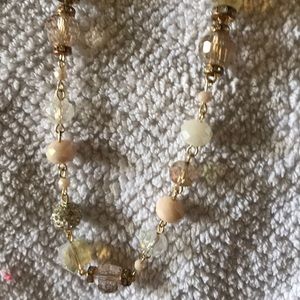 Long glass bead necklace in beige/ pink stones